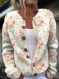 Grof gebreid vest met roze bloemen