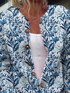Vest met blauw-witte vogelprint