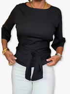 Dames top met knoop in de taille