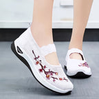 MET BLOEMEN GEBORDUURDE SNEAKERS VOOR DAMES